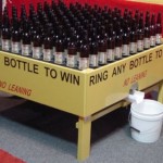 Picture of bottles used in ring toss game in a carnival
